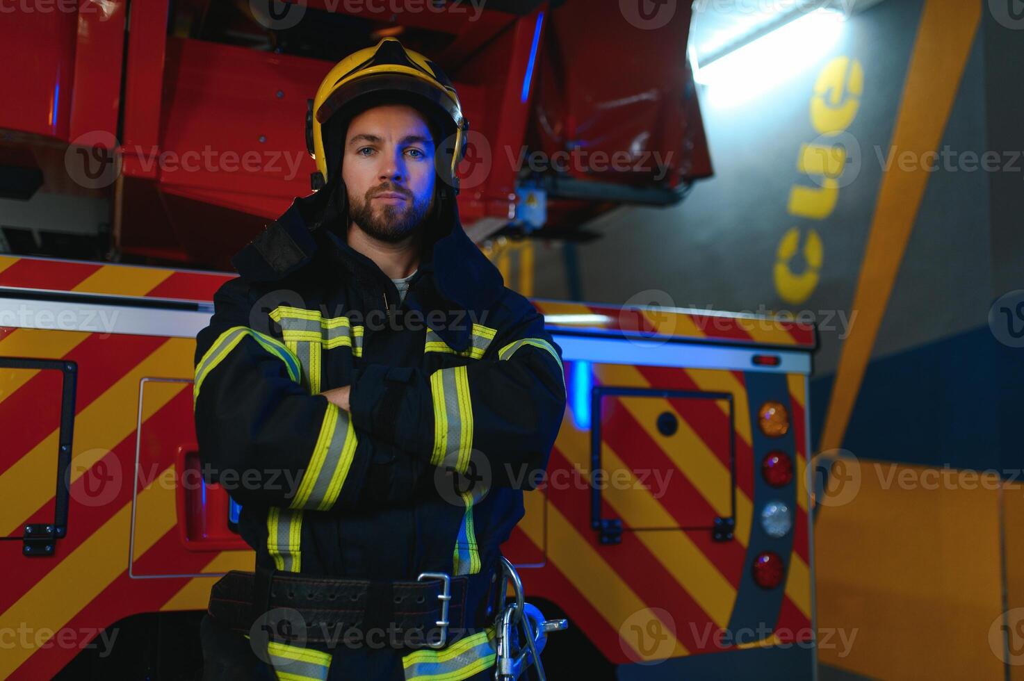 Photo of fireman with gas mask and helmet near fire engine