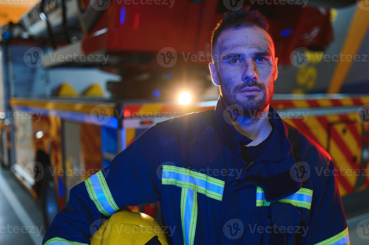 tired firefighter after work in a fire department photo