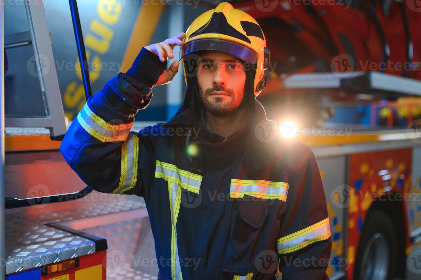 Photo of fireman with gas mask and helmet near fire engine