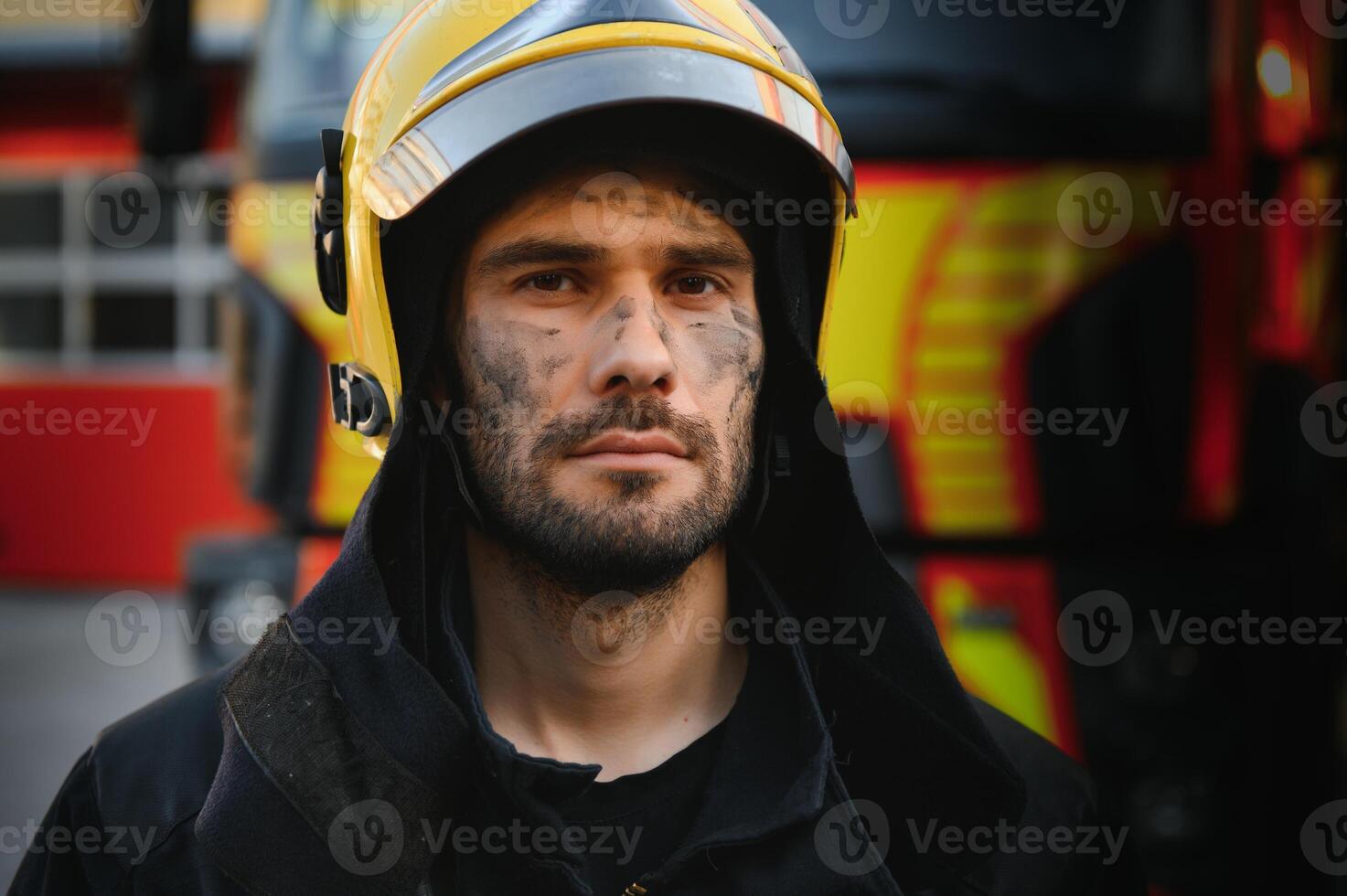 Firefighter rests after fighting a house fire photo