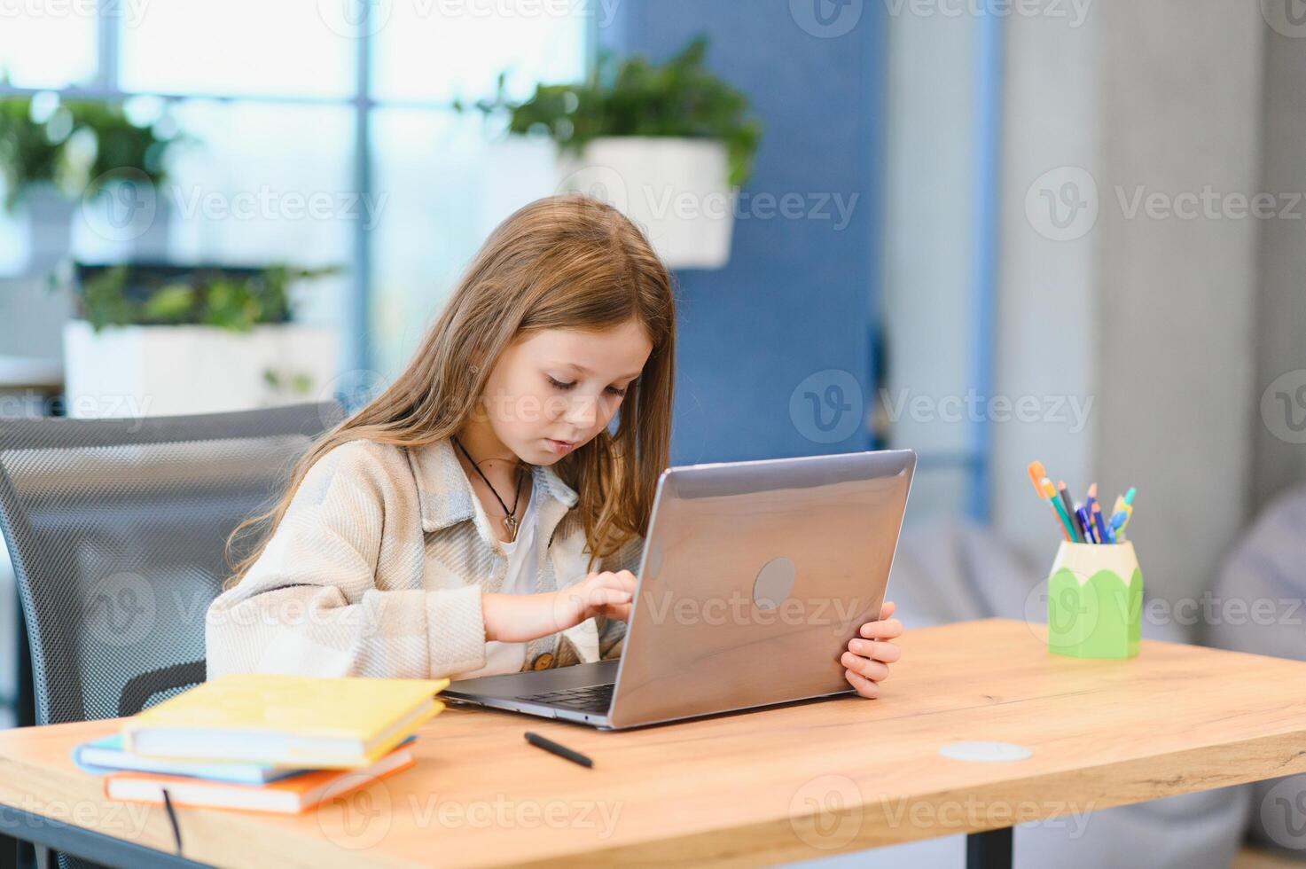 Smiling little Caucasian girl have call distant class with teacher photo