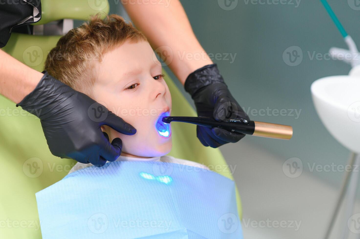 Crying and screaming little boy at the dentist photo