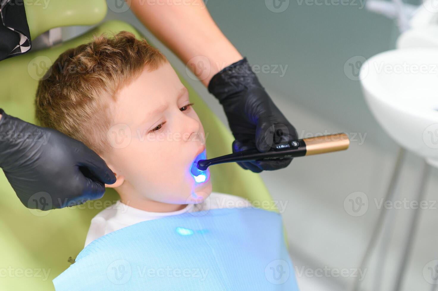 Crying and screaming little boy at the dentist photo