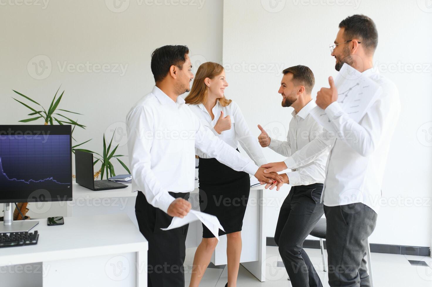 Team of brokers is working in office using workstation and analysis technology. photo