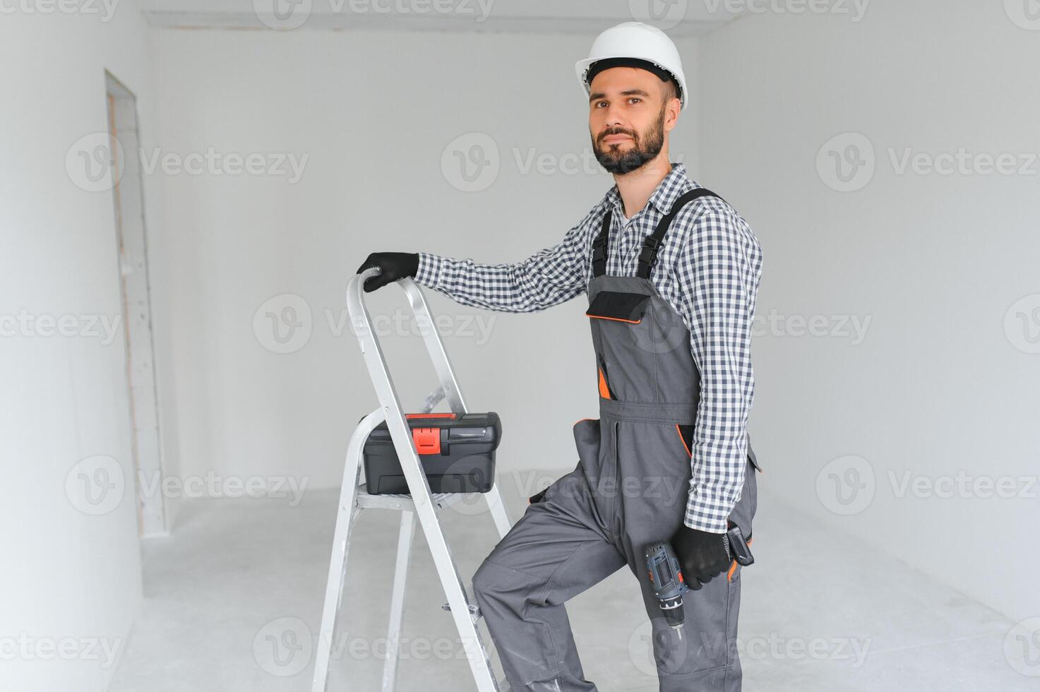Handsome worker in empty room. photo
