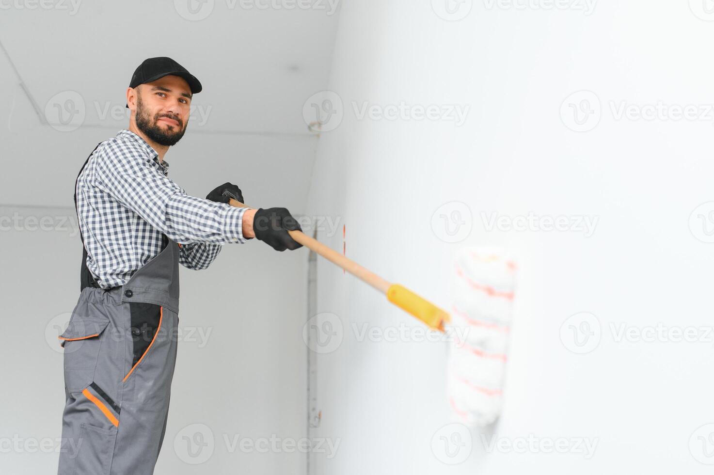 Young worker making repair in room. photo