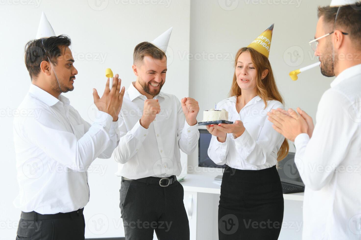 business team celebrating a birthday in the office. photo