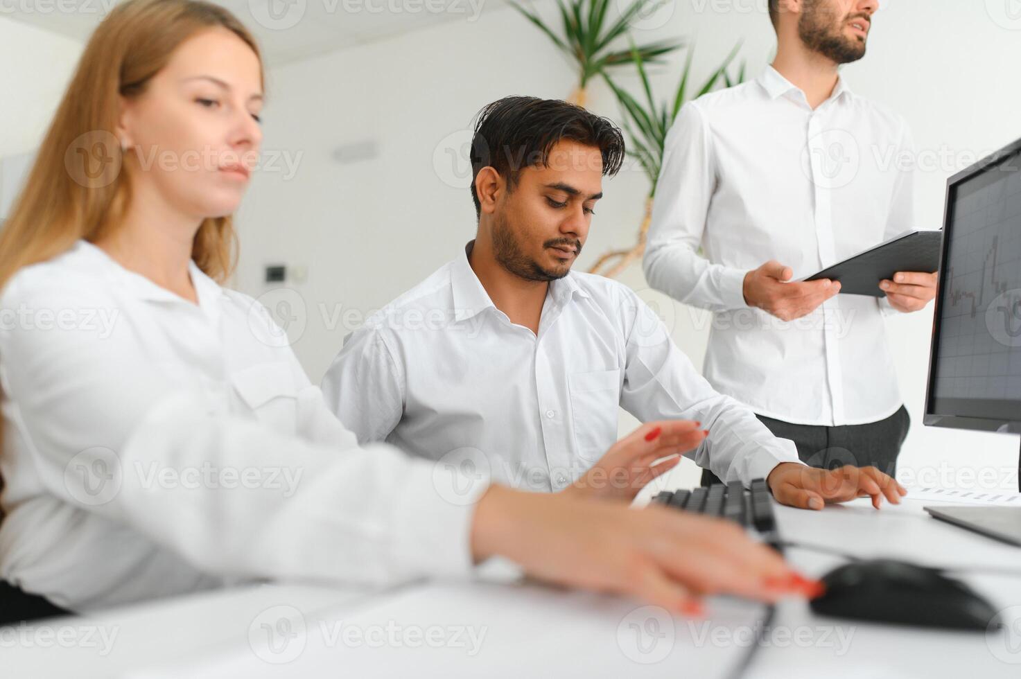 Business team working on their business project together at office. photo