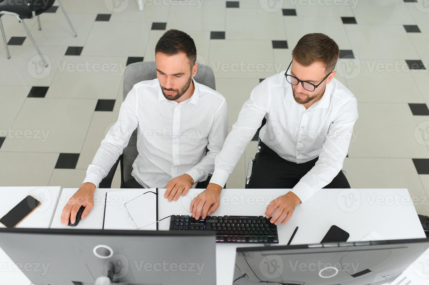 Two diverse crypto traders brokers stock exchange market investors discussing trading charts research reports growth using pc computer looking at screen analyzing invest strategy, financial risks photo