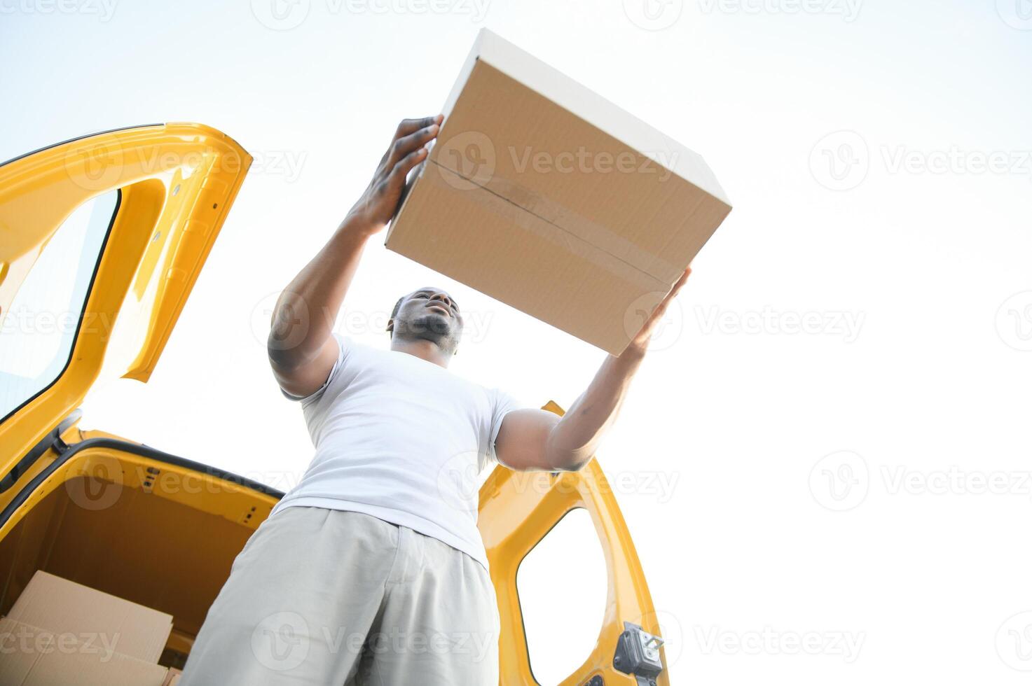 Courier Service. Delivery Man With Boxes Near Car photo