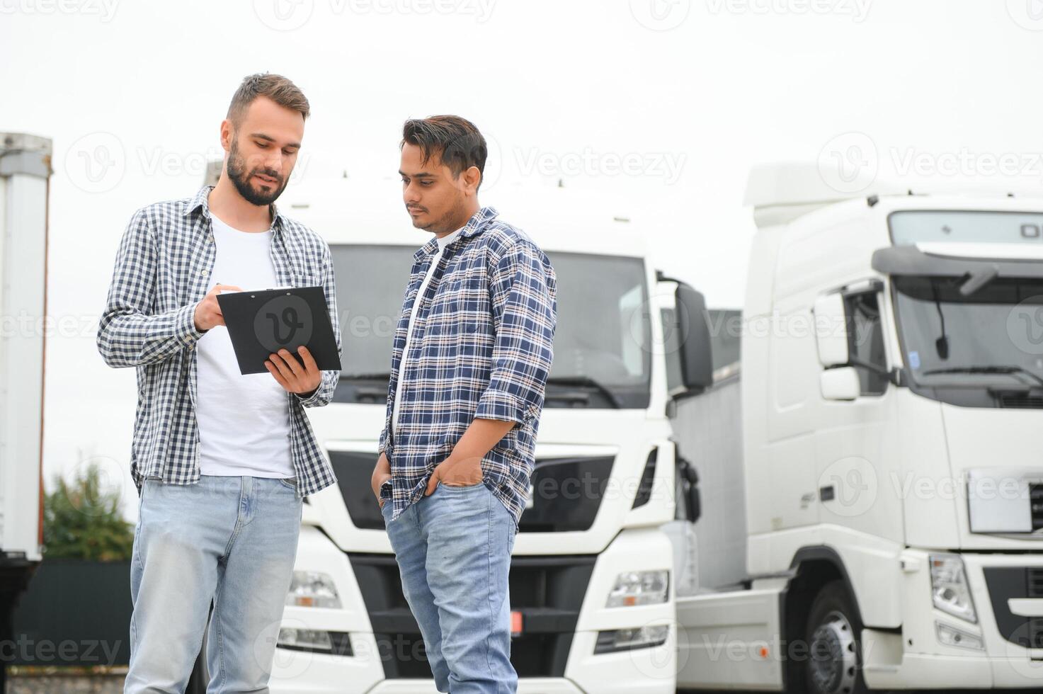 The truck driver delivered the cargo to the customer photo