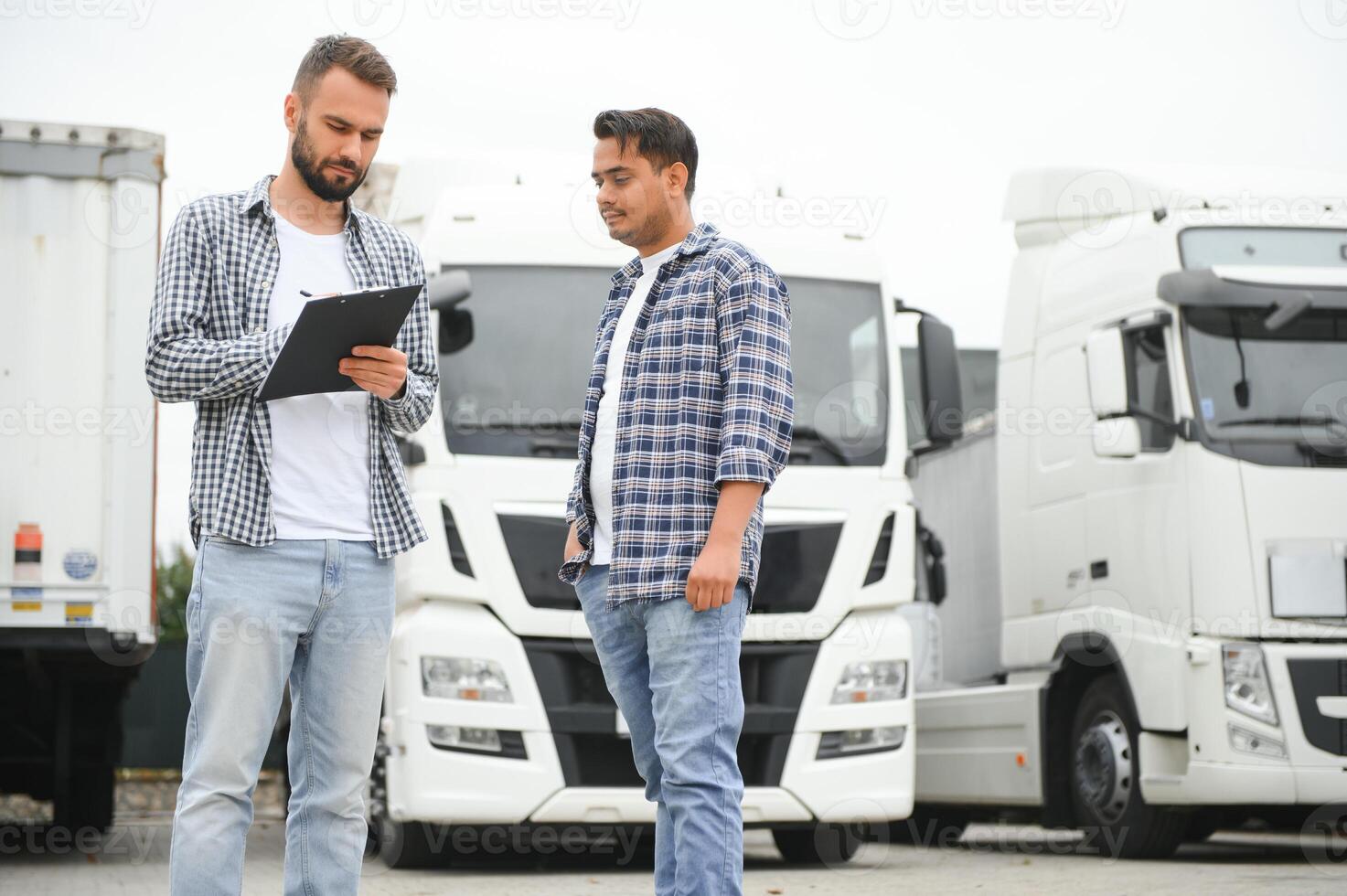 The truck driver receives documents for the cargo and the delivery route photo