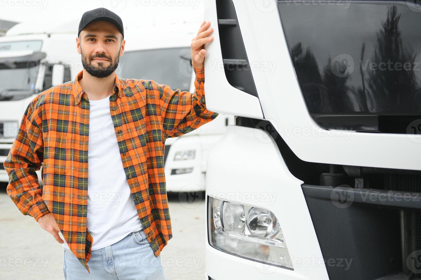 Portrait of confident truck driver on parking lot. Copy space photo