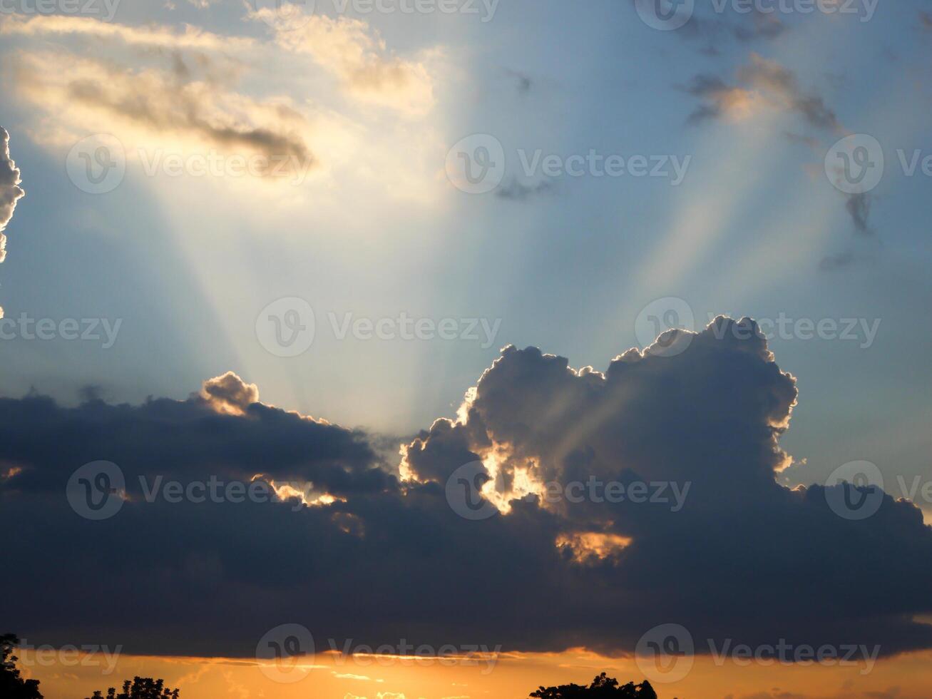 Spectacular sunset over, orange sun rising up over the horizon photo