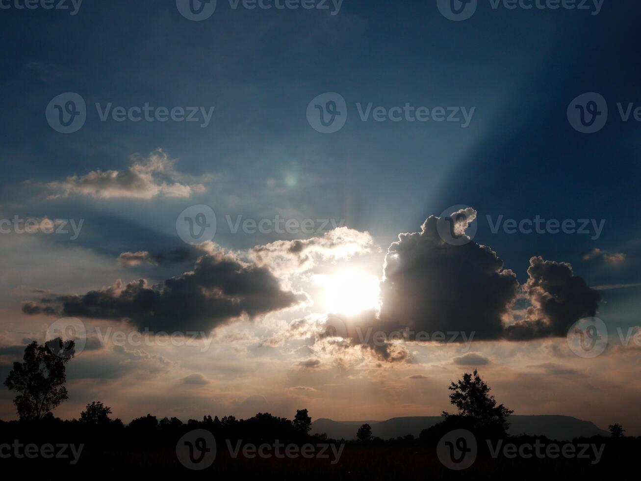 Spectacular sunset over, orange sun rising up over the horizon photo