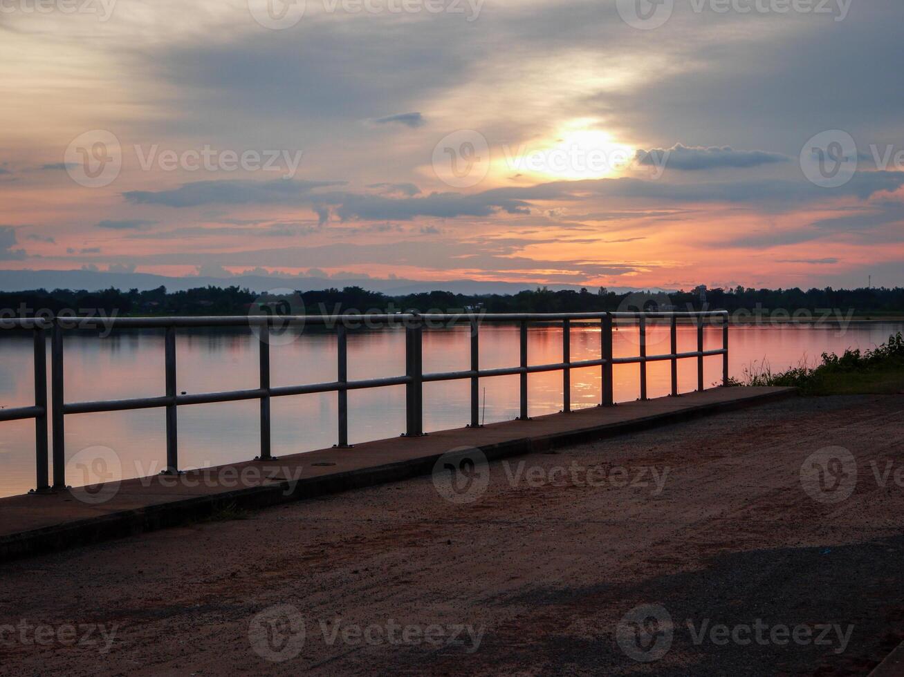 Spectacular sunset over, orange sun rising up over the horizon photo