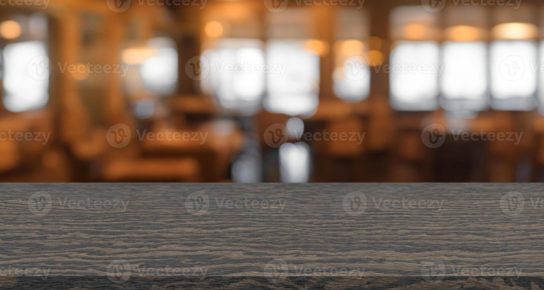 empty ebony wood table top with blurry background, blank counter for product montage advertising photo