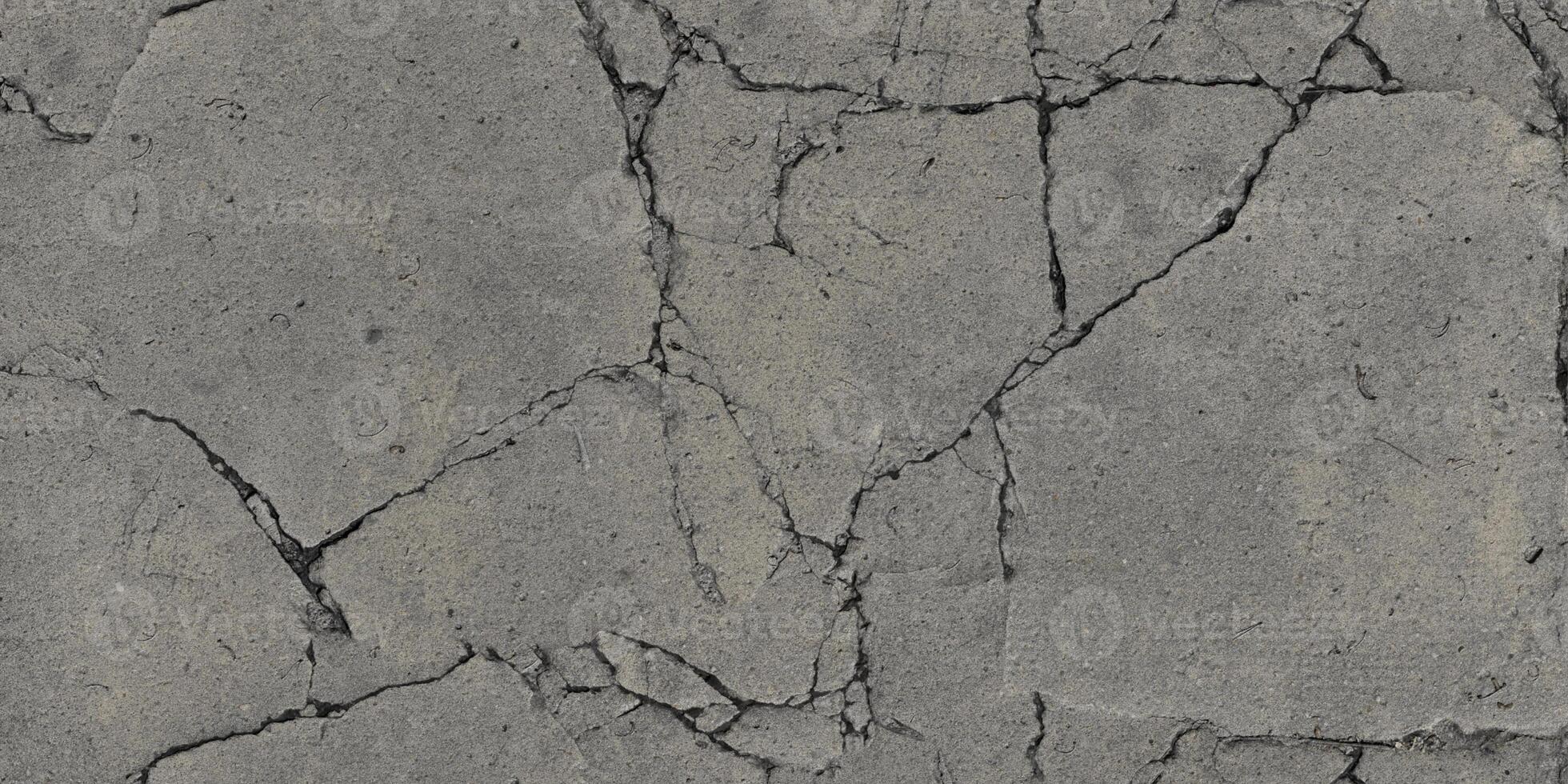 heavy cracked concrete sidewalk photo