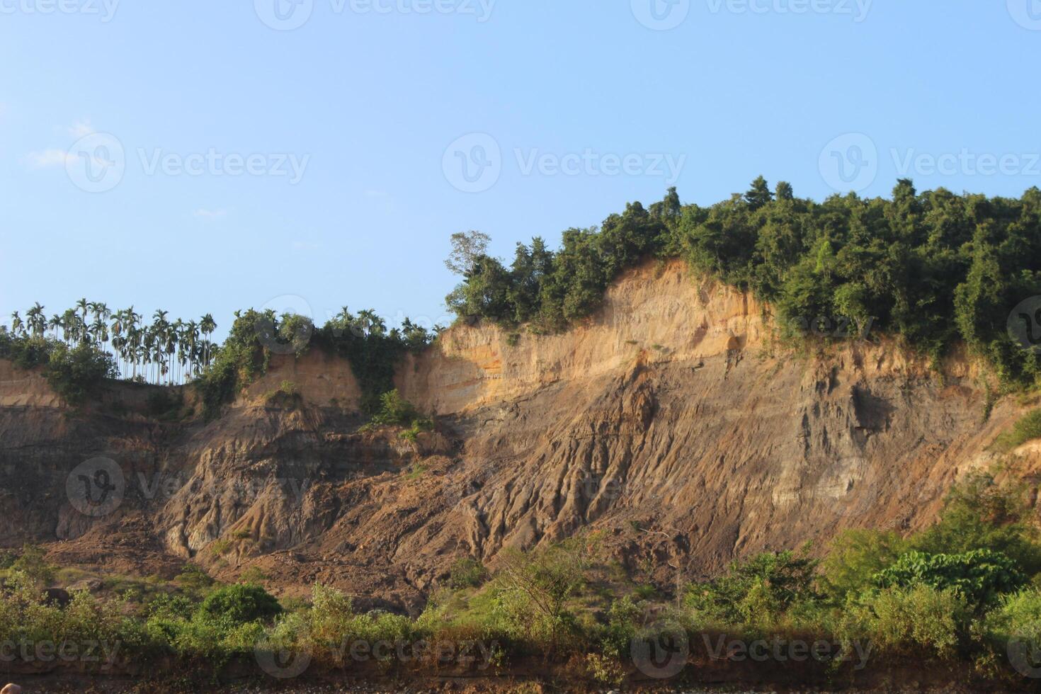 You can use the hill cliffs on the edge of the river as wallpaper photo