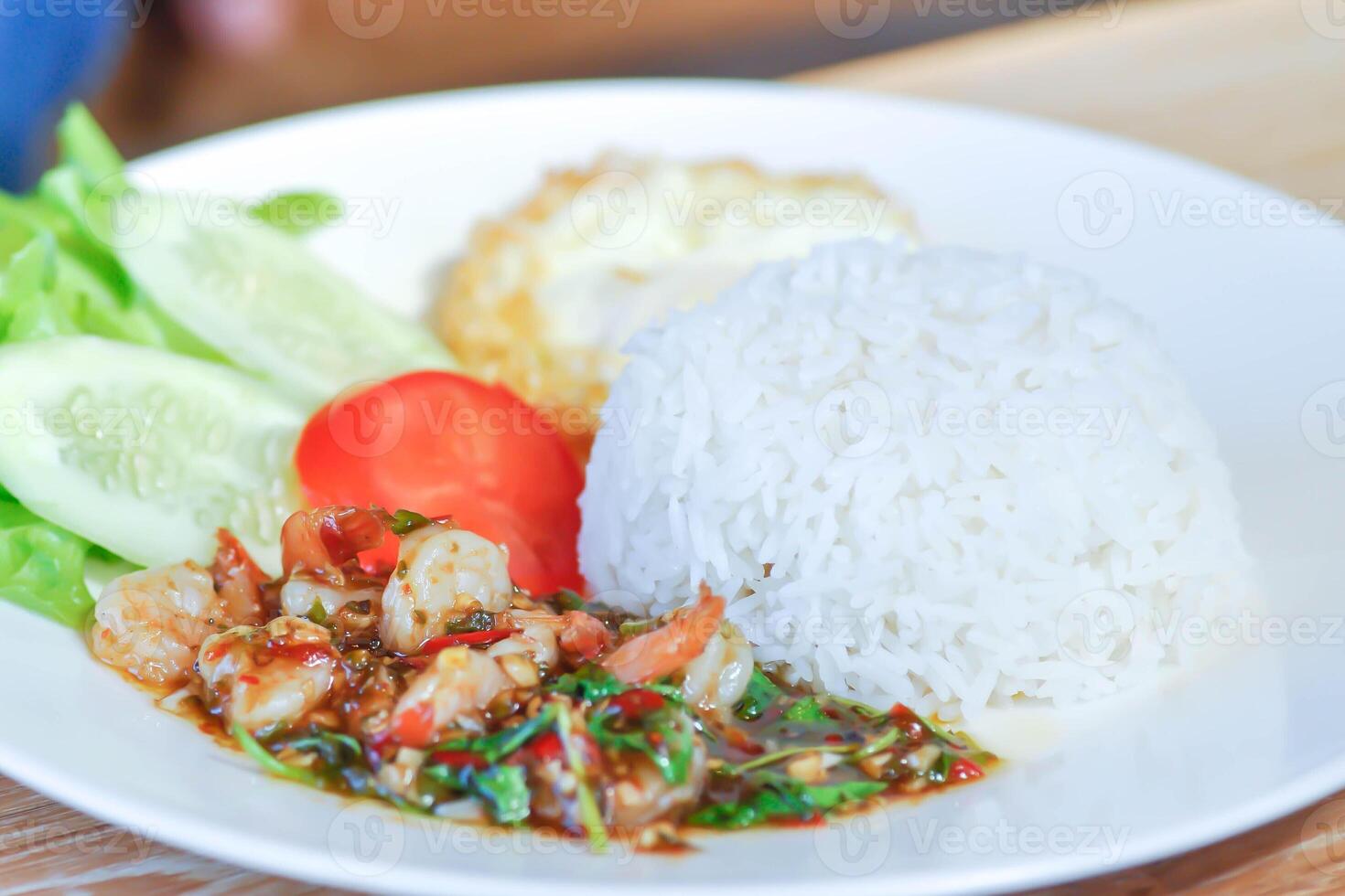 stir fried shrimp with holy basil and sunny side up egg or fried egg photo