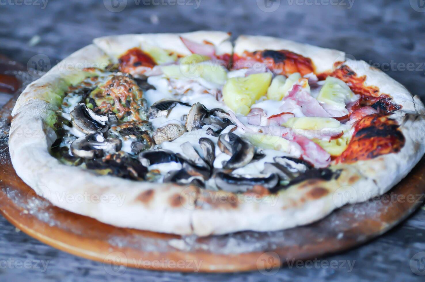 Hawaiian pizza and pesto mushroom pizza ,half and half topping pizza or split half topping pizza photo