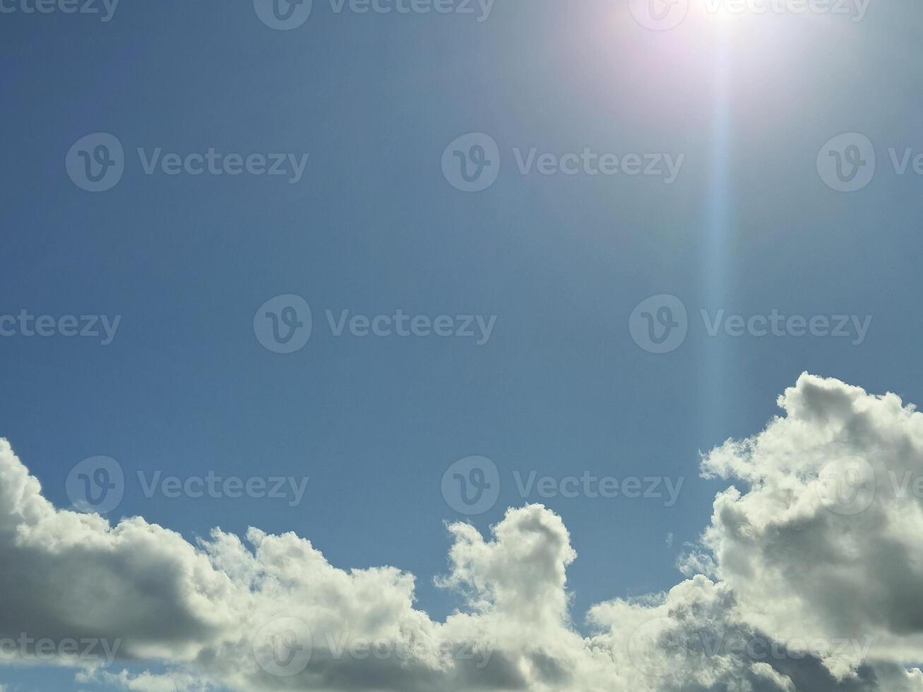 White fluffy cumulus clouds in the summer sky, natural clouds background photo