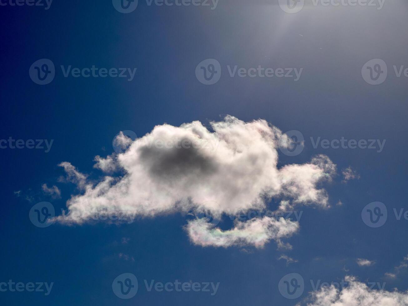 Cumulus clouds in the sky. Fluffy cloud shapes photo
