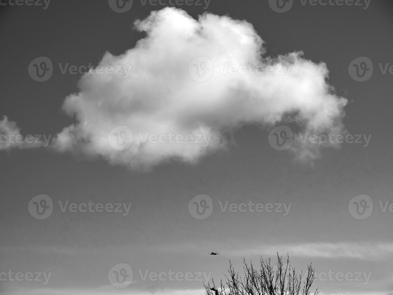Black and white clouds in the sky background photo