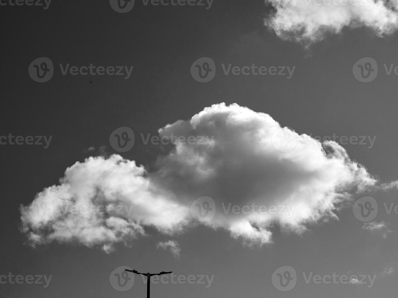 Black and white clouds in the sky background photo