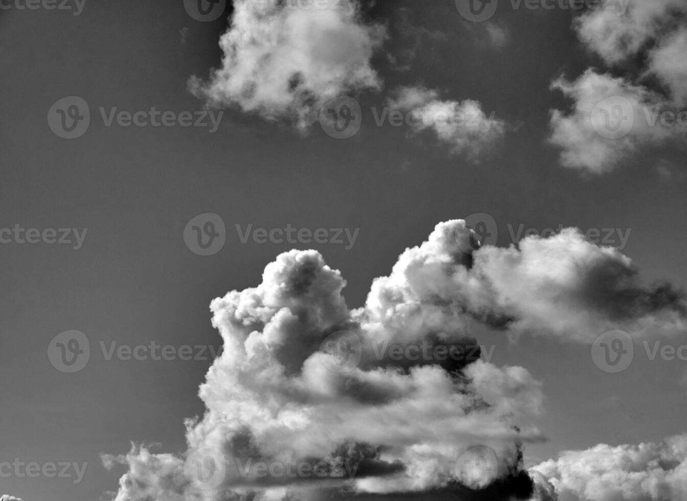 Black and white clouds in the sky background photo