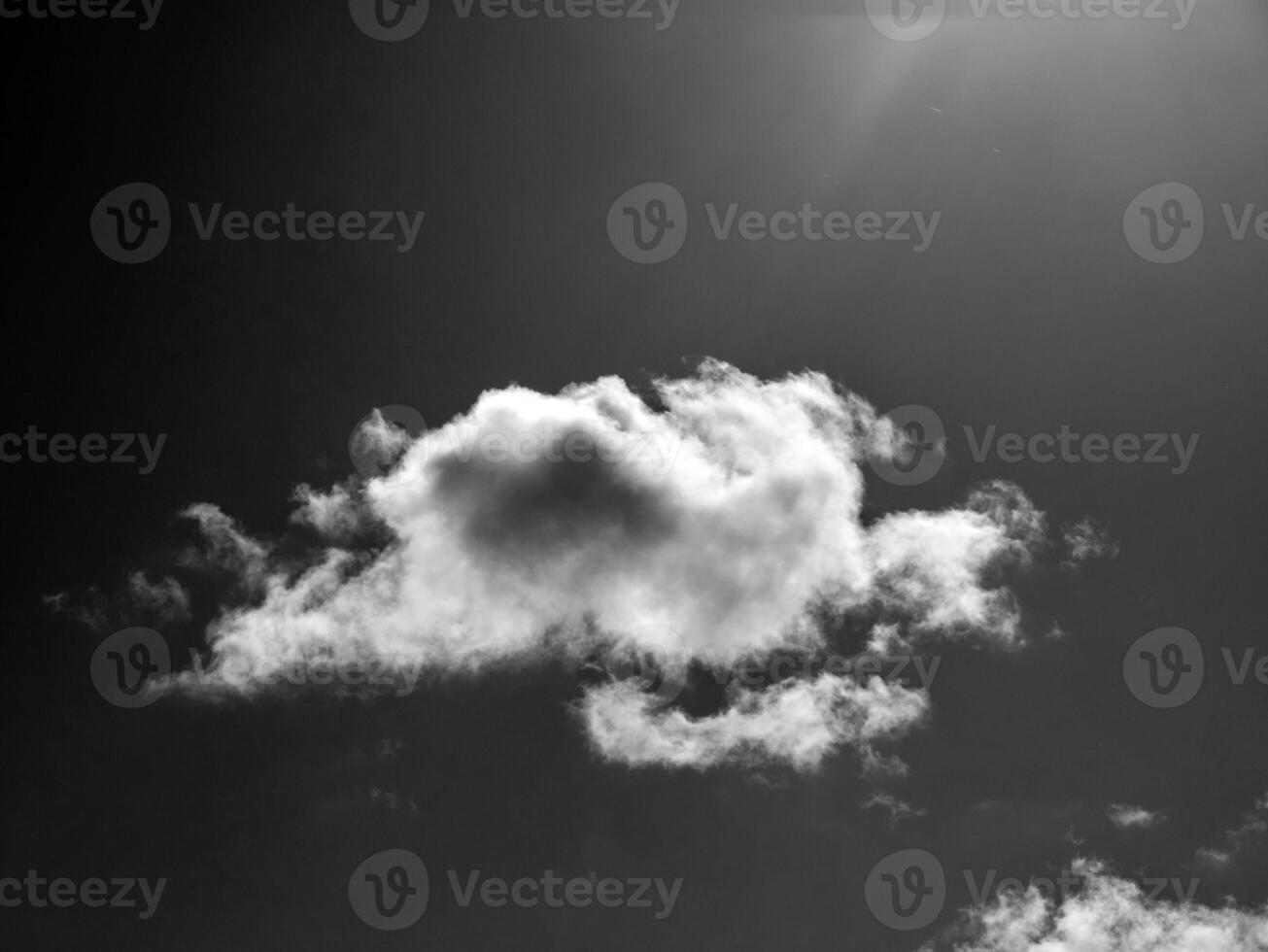 Black and white clouds in the sky background photo