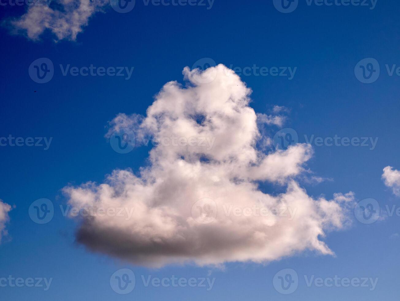 Cumulus clouds in the sky. Fluffy cloud shapes photo