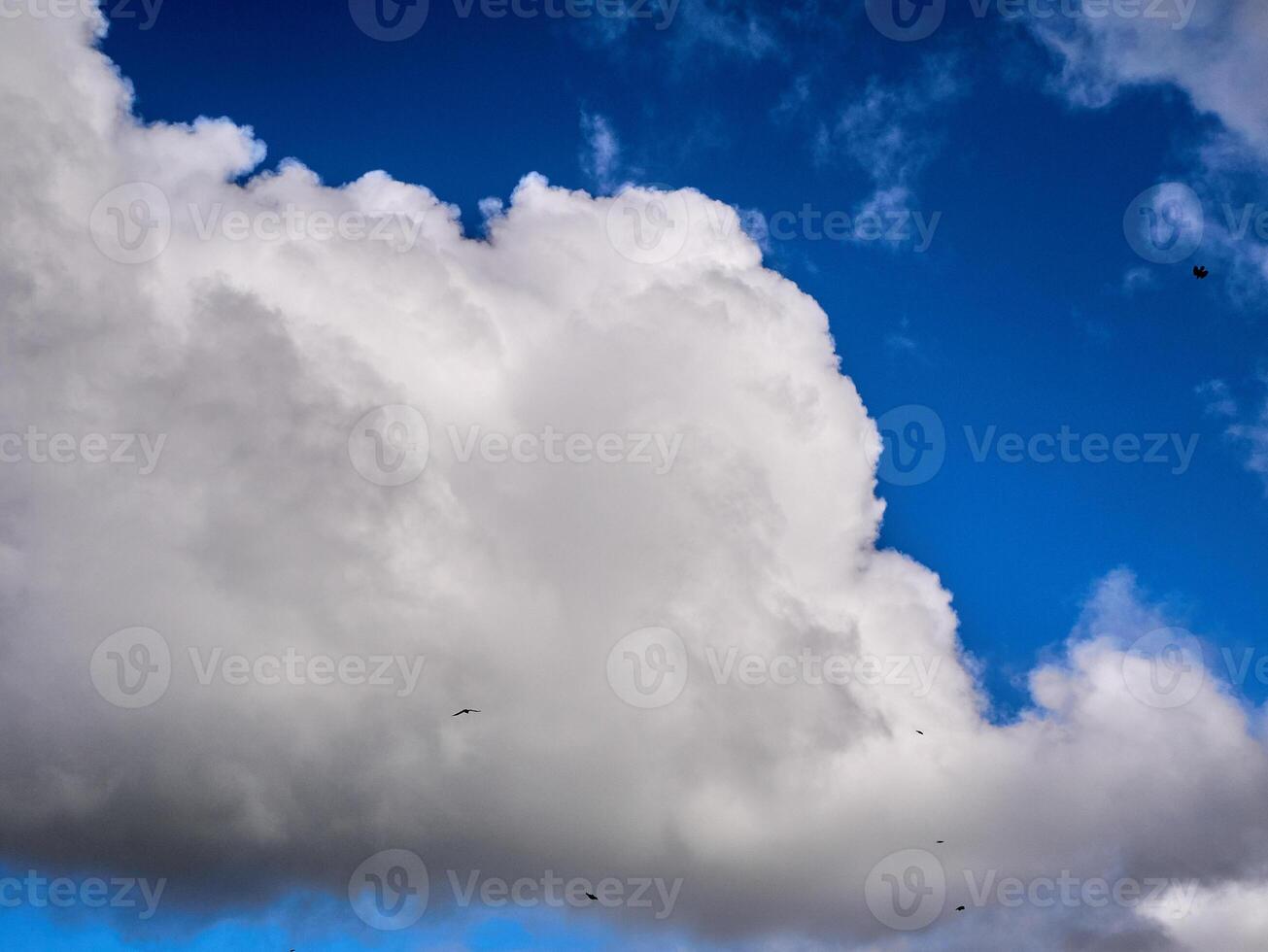 White fluffy clouds in the deep blue sky. Heaven background photo