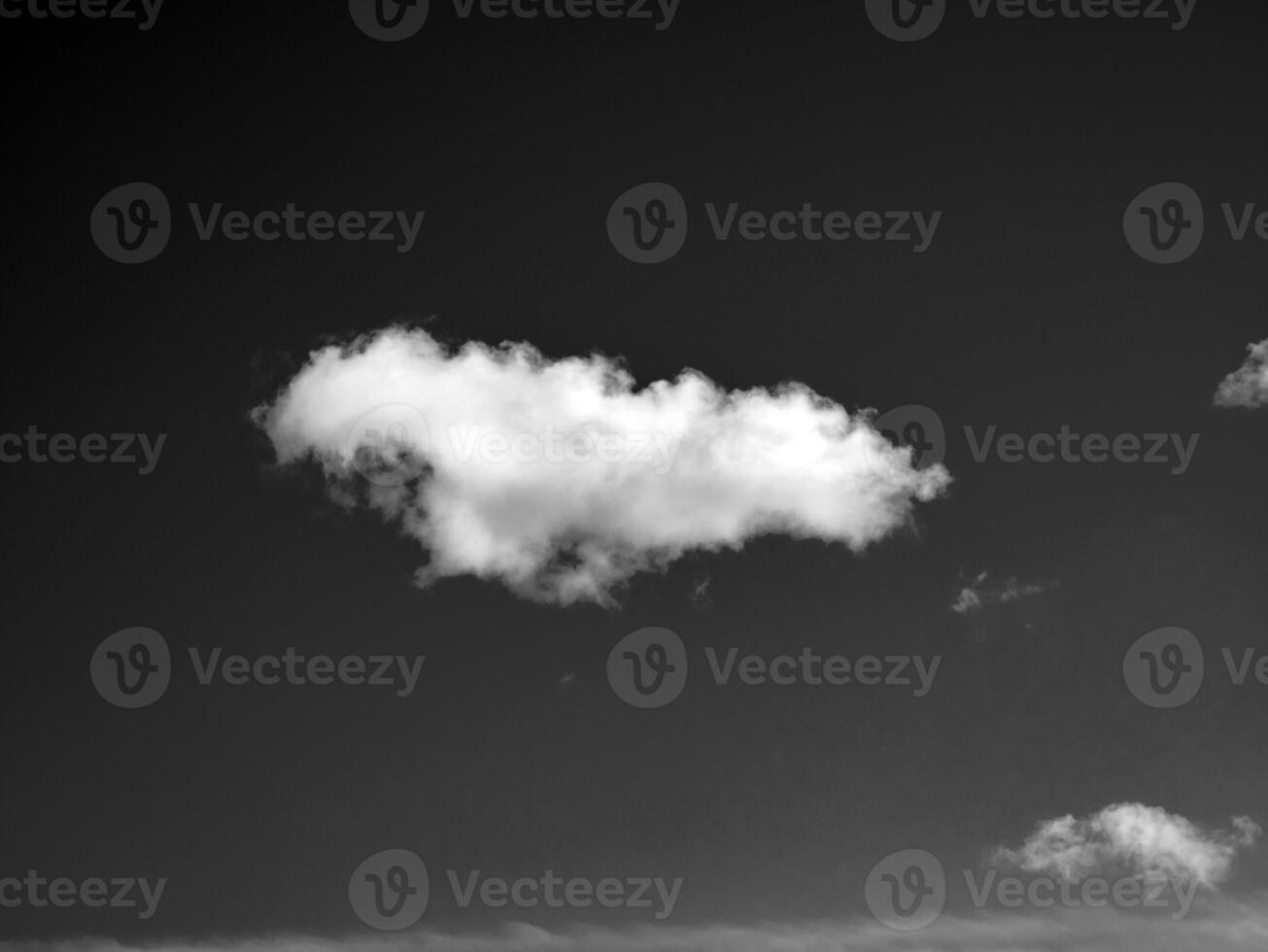 Black and white clouds in the sky background photo