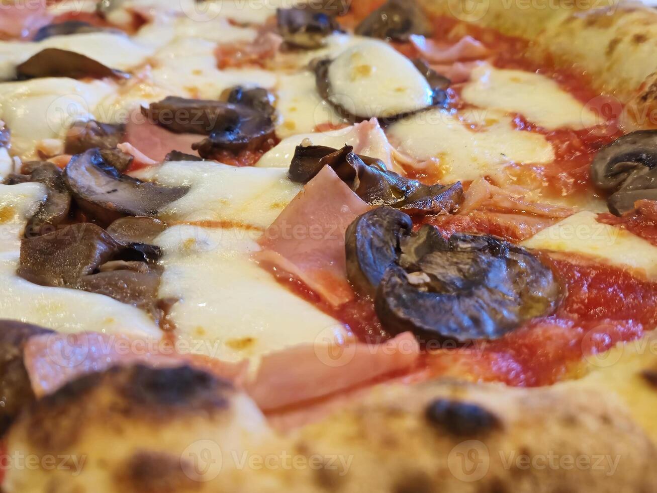 Tasty pizza close view background. Italian pizzeria atmosphere photo