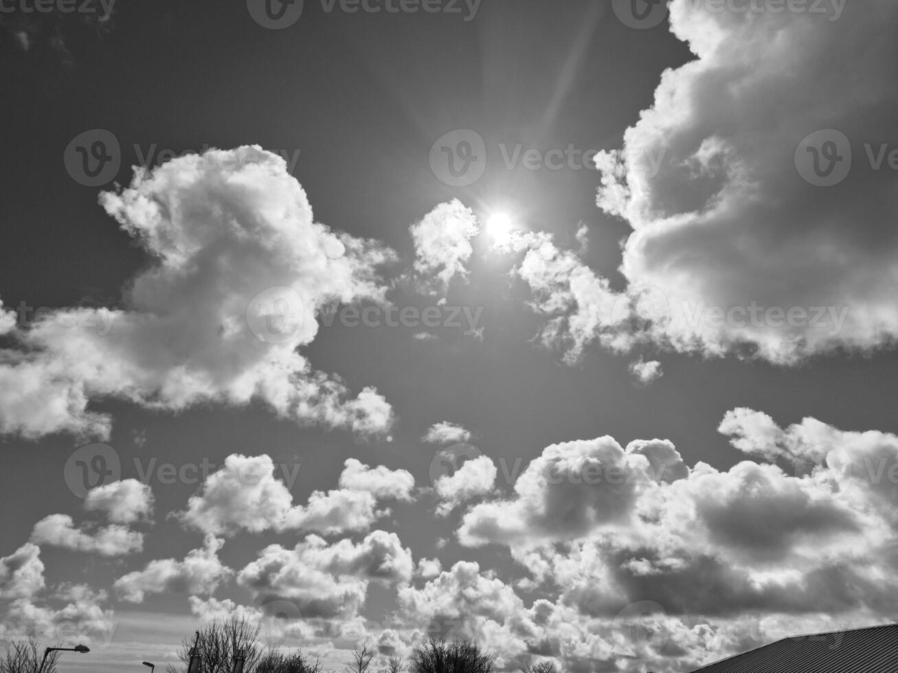 Black and white clouds in the sky background photo