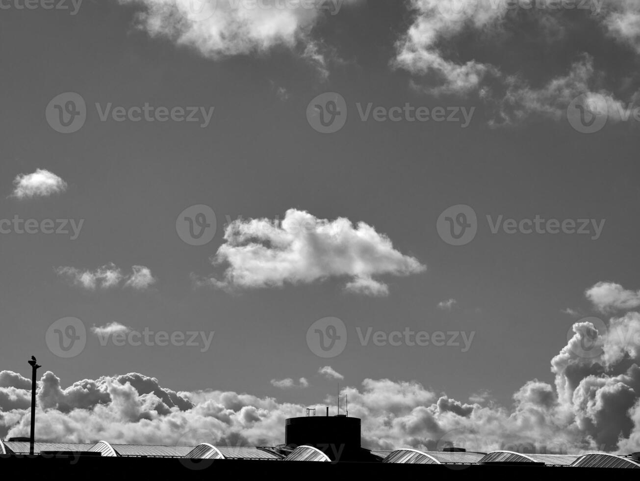 Black and white clouds in the sky background photo