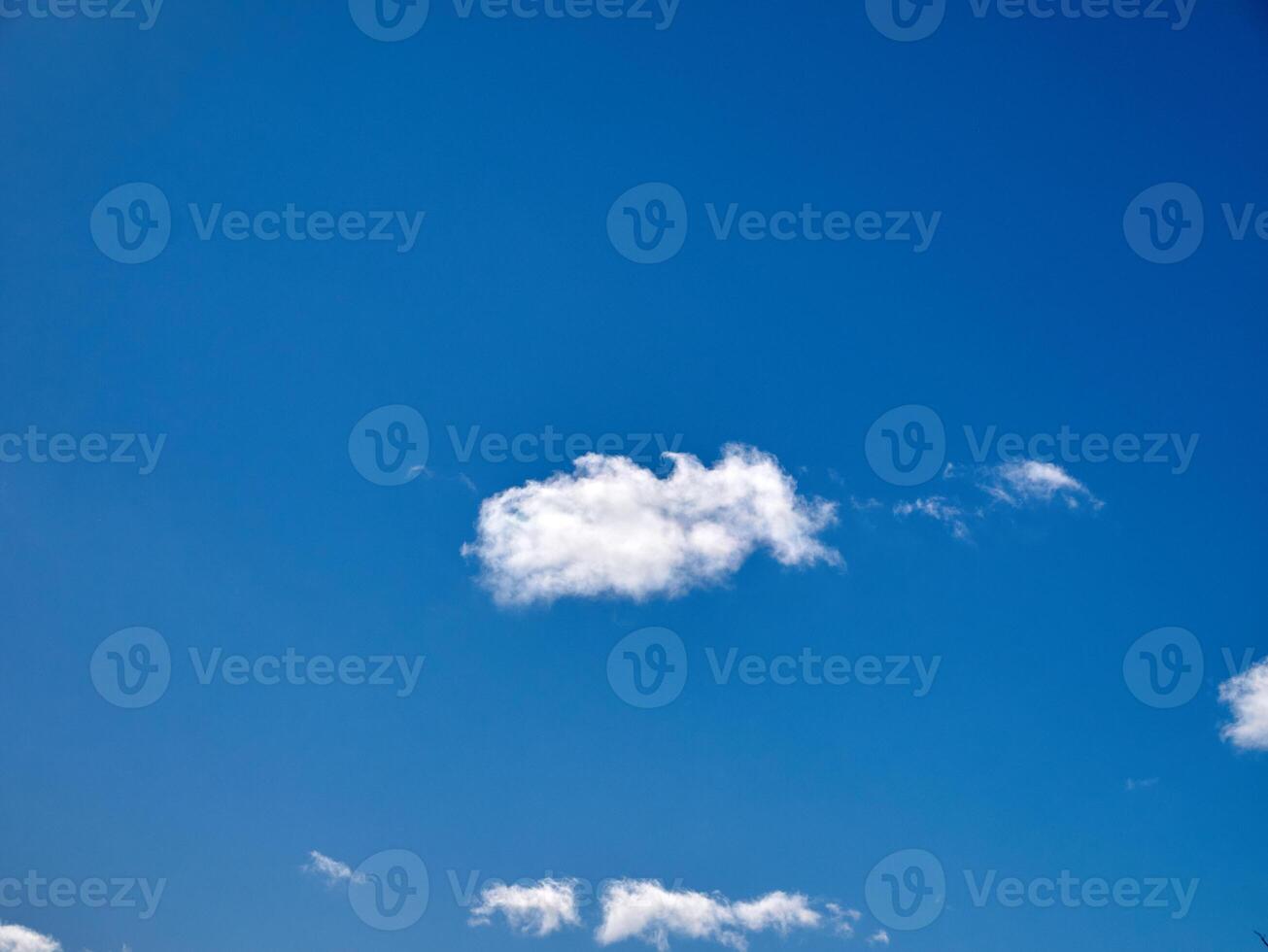 White fluffy clouds in the sky background. Cumulus clouds photo