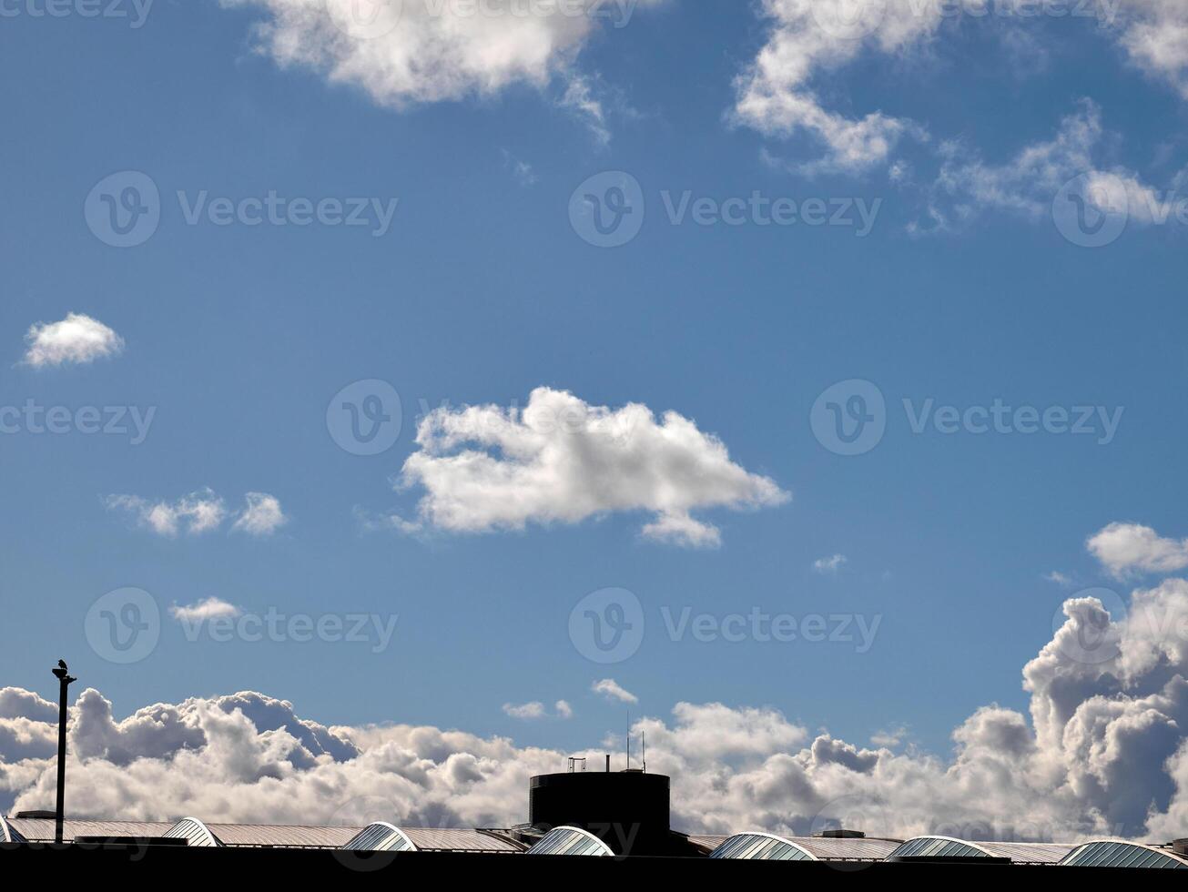 Cumulus clouds in the sky. Fluffy cloud shapes photo