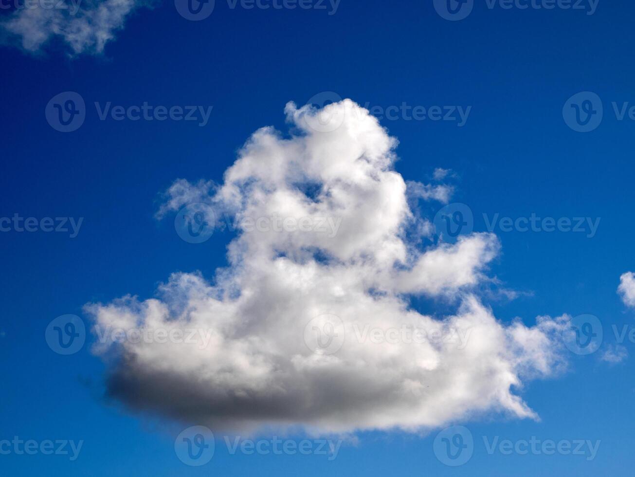 Cumulus clouds in the sky. Fluffy cloud shapes photo