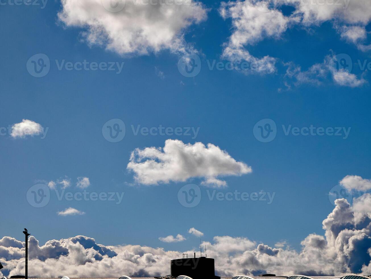 Cumulus clouds in the sky. Fluffy cloud shapes photo