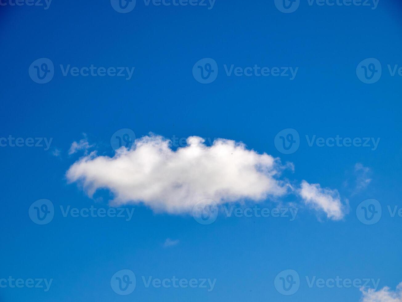 Cumulus clouds in the sky. Fluffy cloud shapes photo