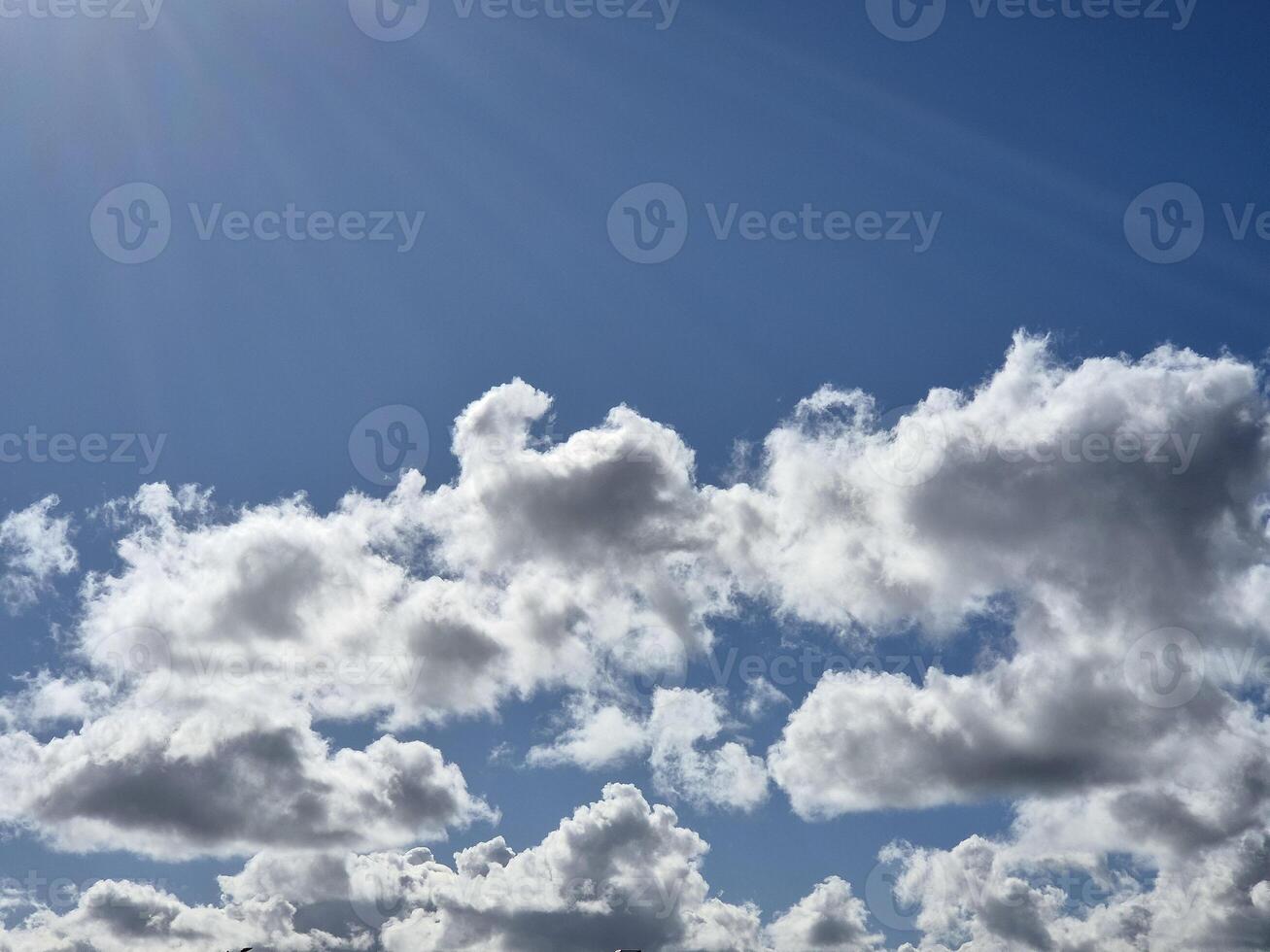 White fluffy cumulus clouds in the summer sky, natural clouds background photo