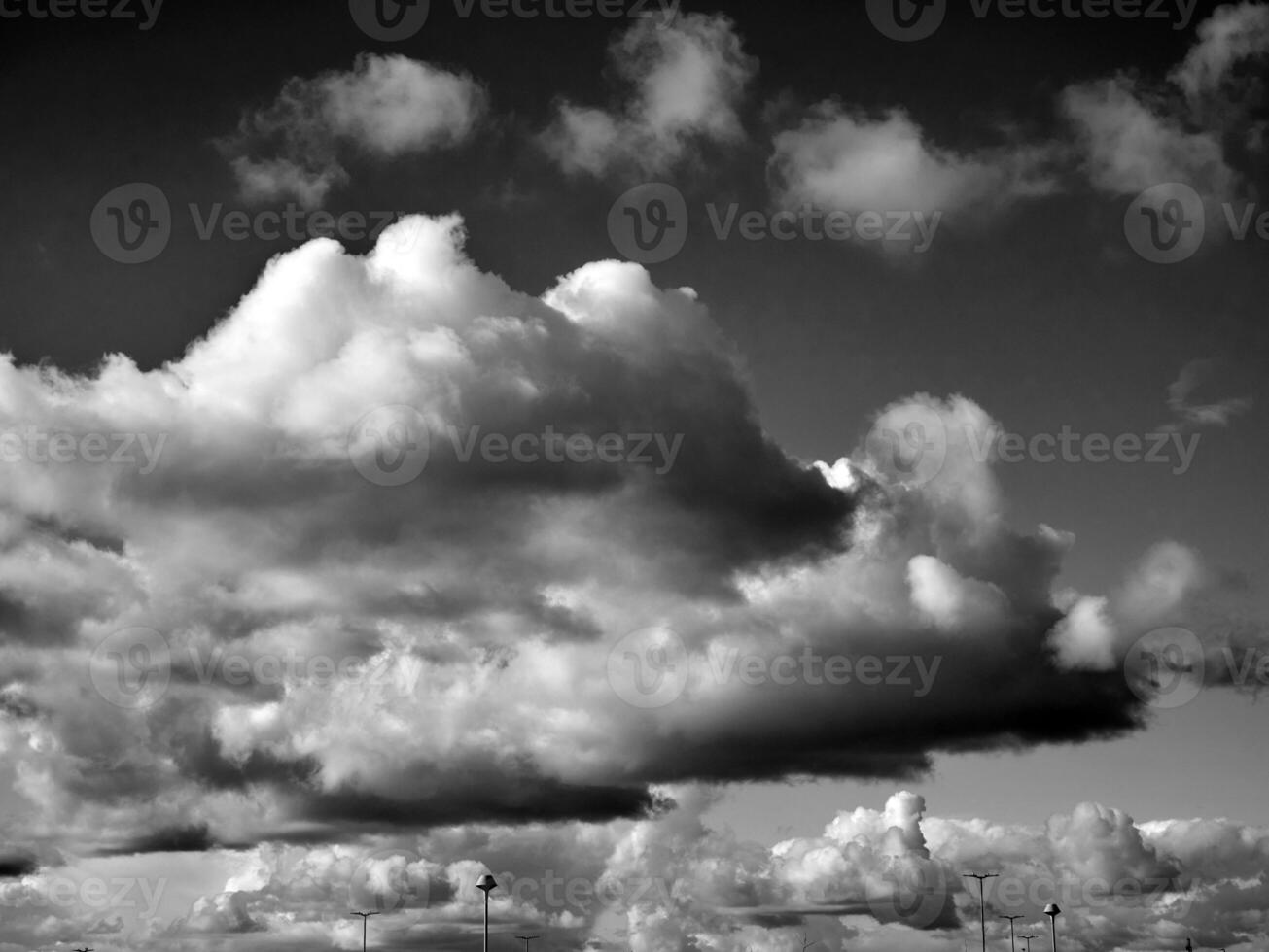 Black and white clouds in the sky background photo