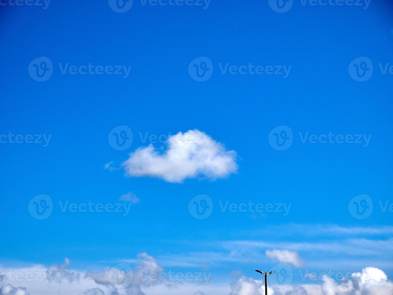 White fluffy clouds in the sky background. Cumulus clouds photo