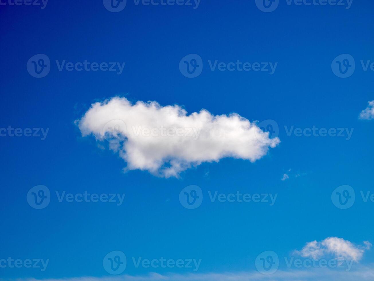 Cumulus clouds in the sky. Fluffy cloud shapes photo