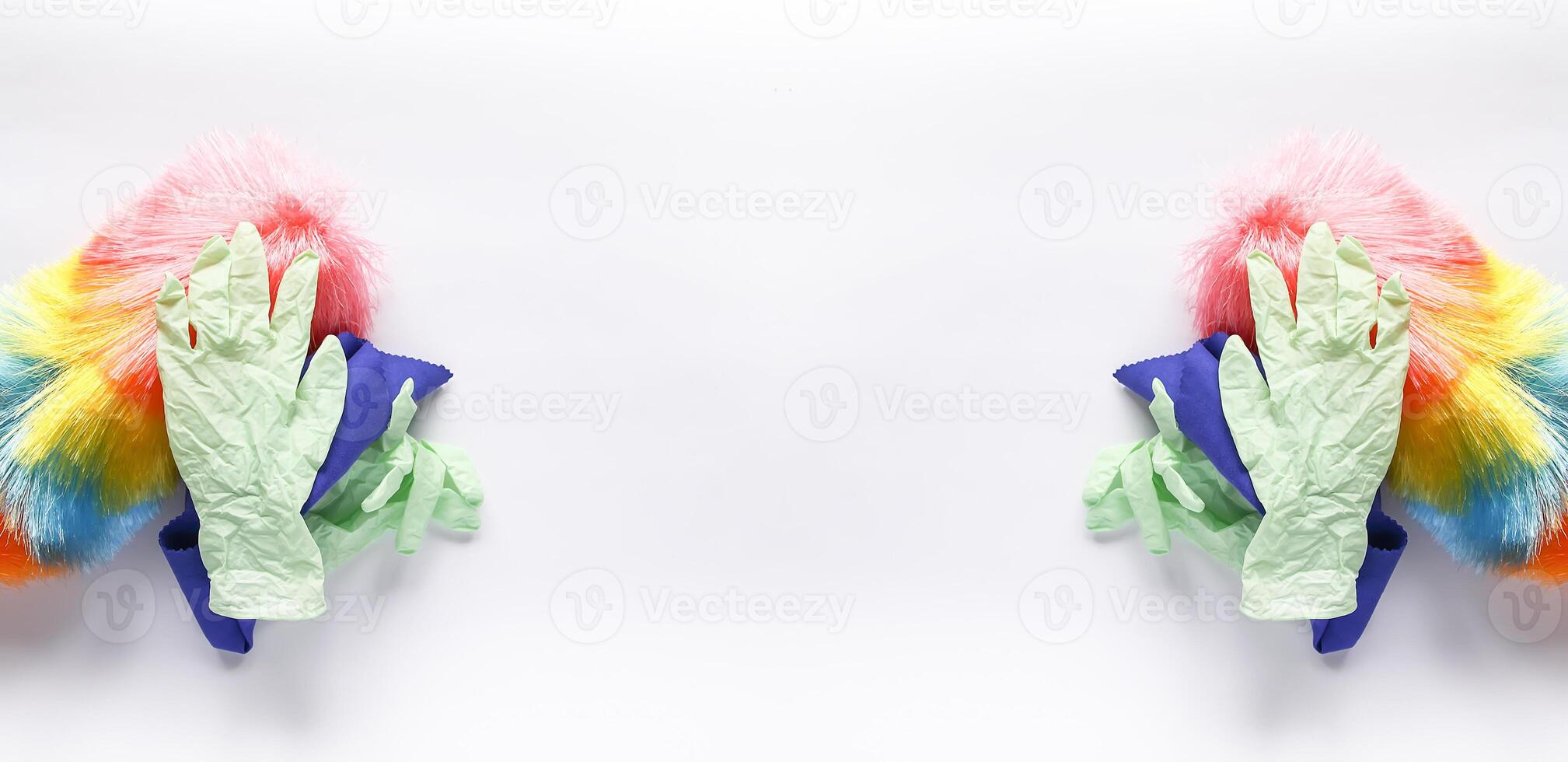 Rubber gloves, the duster and microfiber cloth on light background photo