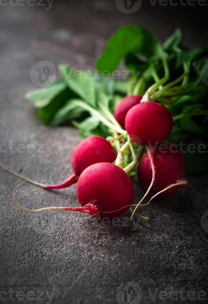 Fresh organic radish on green background photo