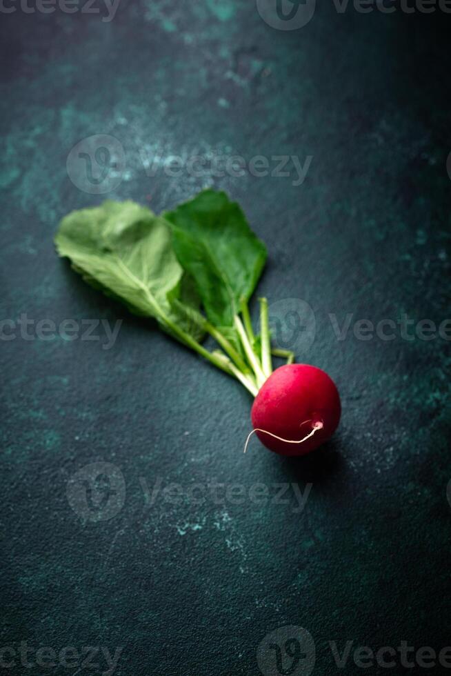 Fresh organic radish on green background photo