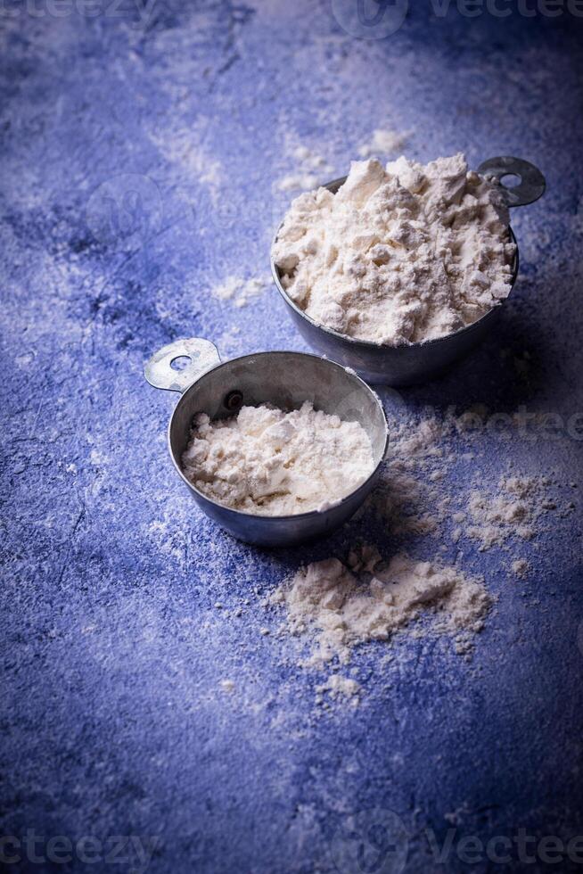 Wheat flour on dark. Baking background photo